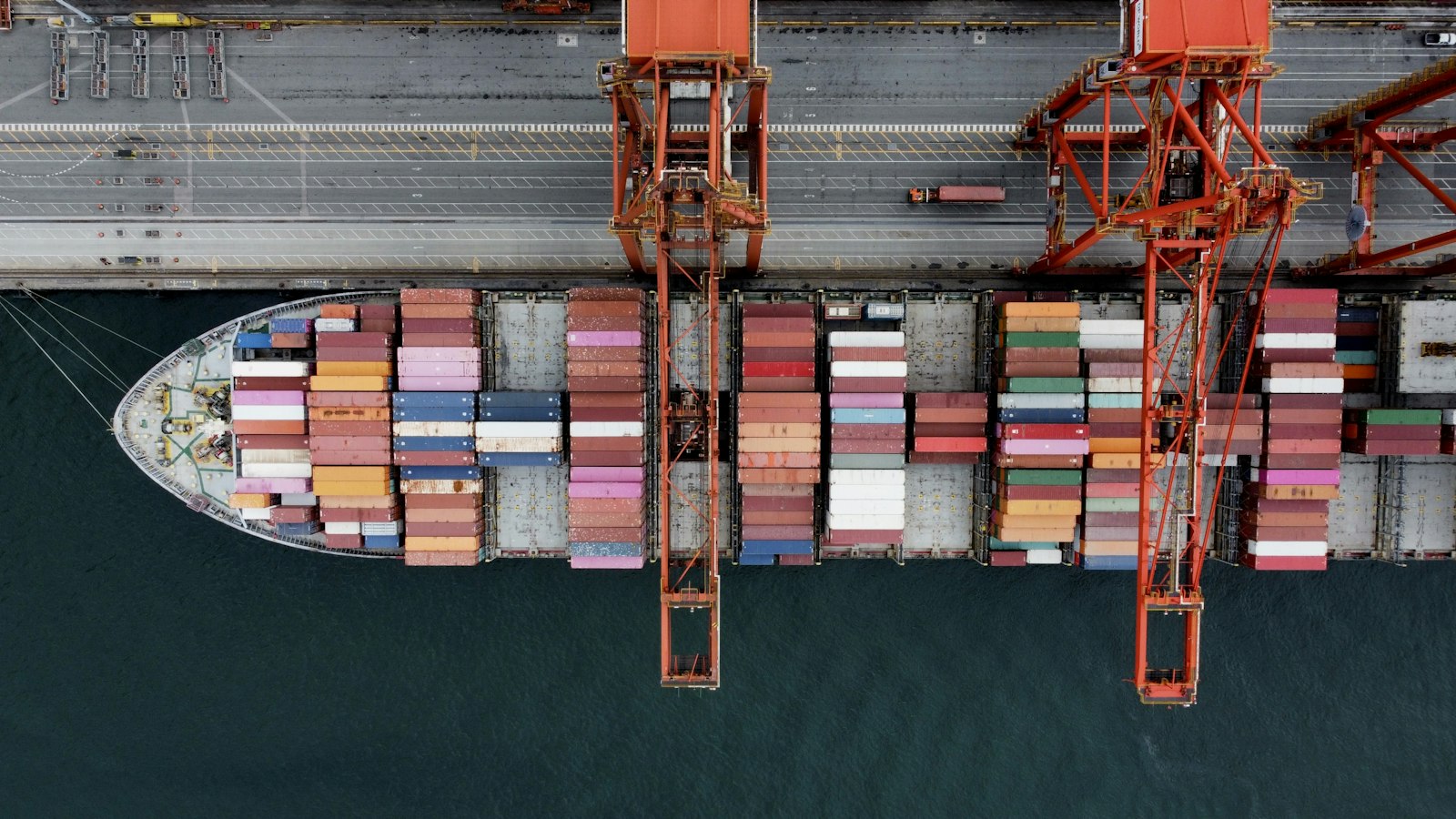 Aerial view of a container ship being loaded at port