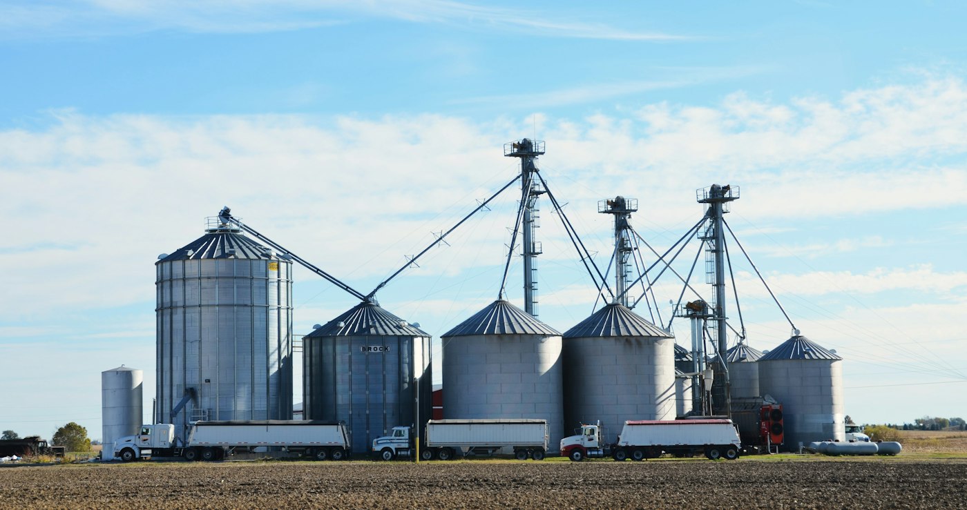 Grain silos with trucks lined up for loading