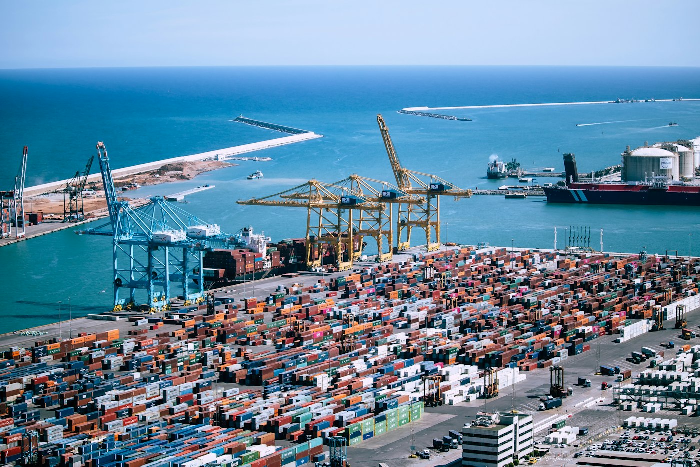 Aerial view of a port with containers and a docked ship
