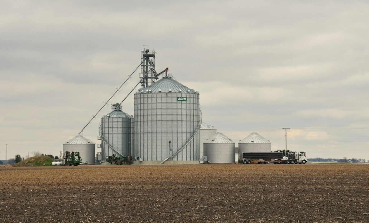 Grain silos beside a field