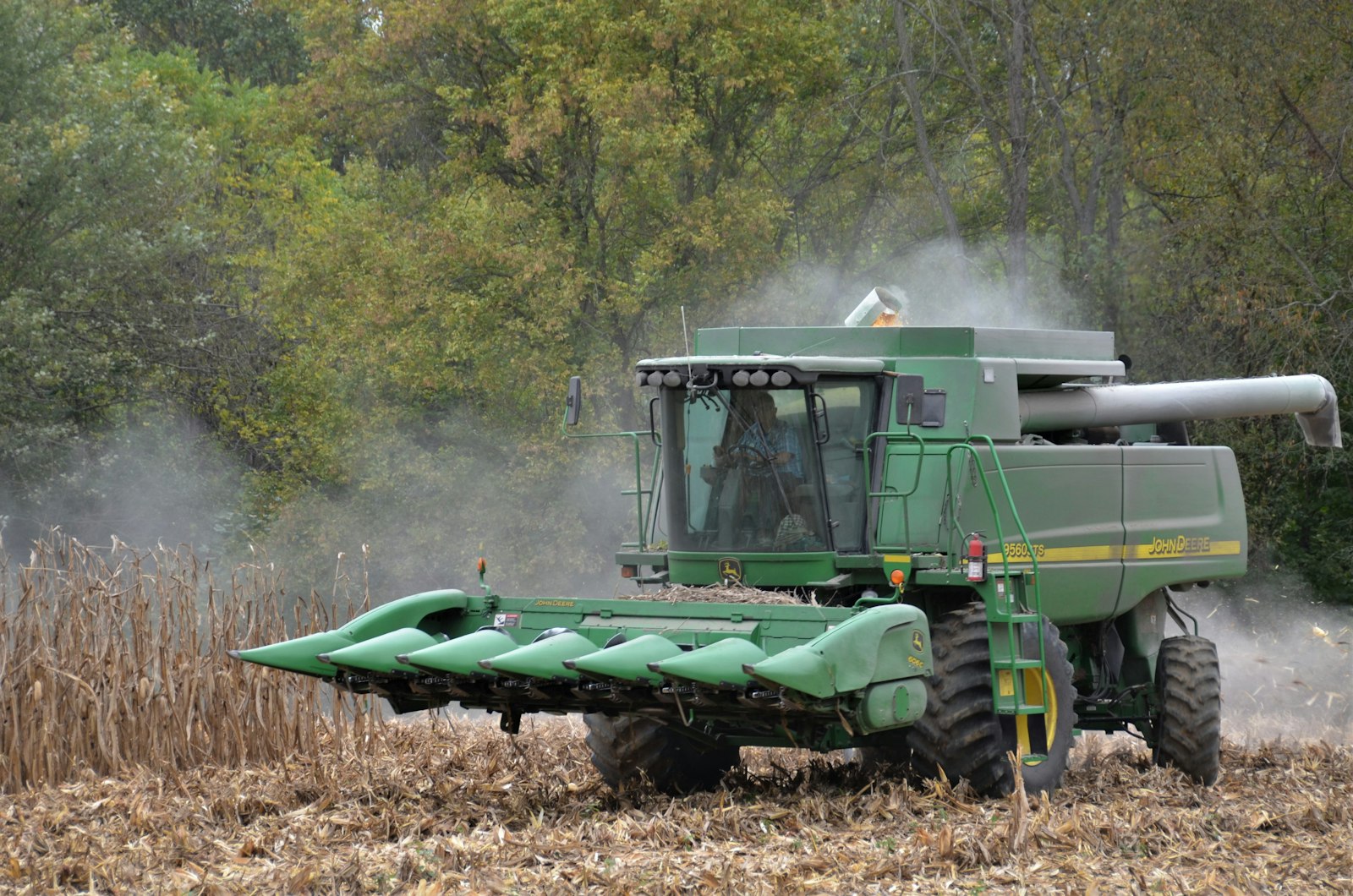 Combine harvester working a corn field